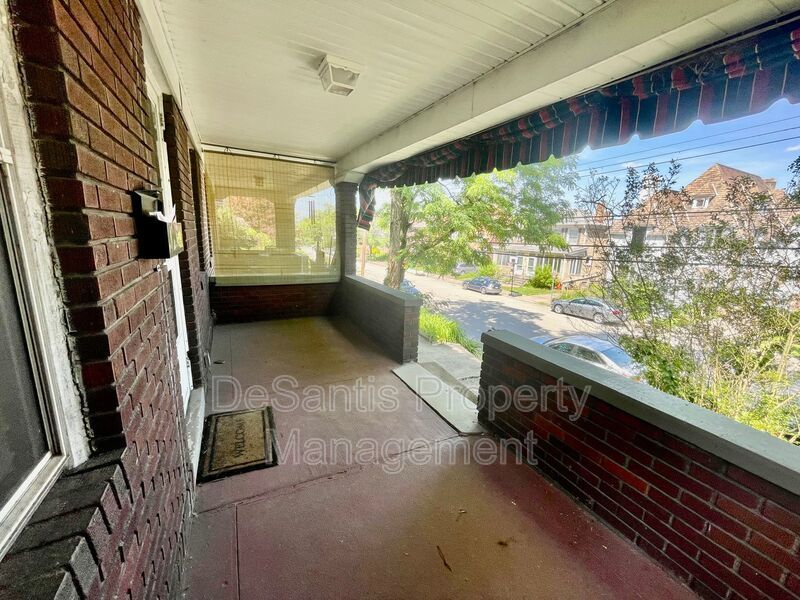 Charming Pittsburgh Retreat: 3-Bed Home with Hardwood Floors, Basement, and Private Porches property image