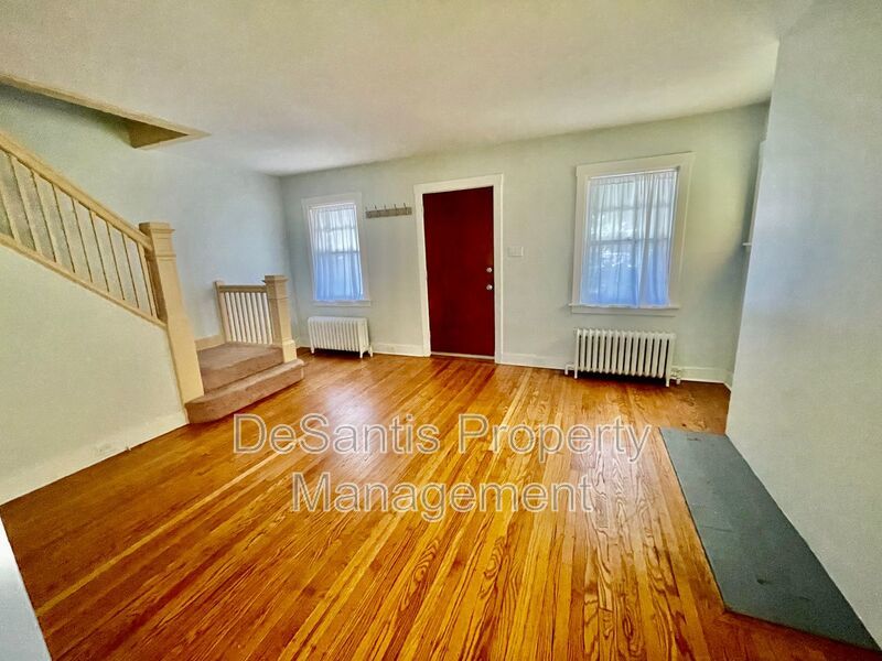 Charming Pittsburgh Retreat: 3-Bed Home with Hardwood Floors, Basement, and Private Porches property image