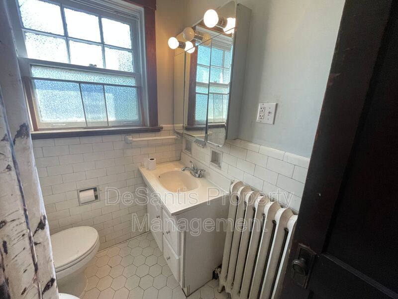 Charming Pittsburgh Retreat: 3-Bed Home with Hardwood Floors, Basement, and Private Porches property image