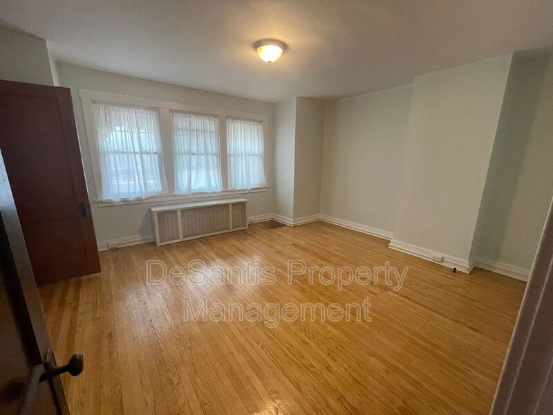 Charming Pittsburgh Retreat: 3-Bed Home with Hardwood Floors, Basement, and Private Porches property image