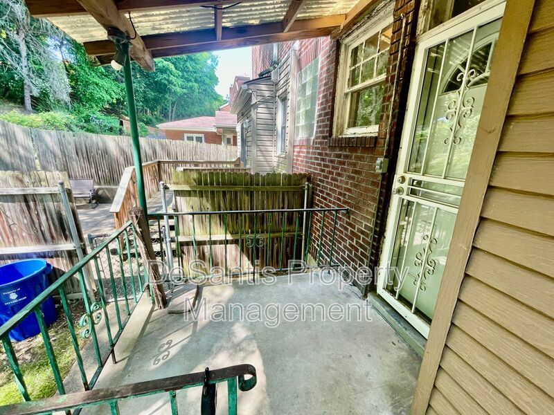 Charming Pittsburgh Retreat: 3-Bed Home with Hardwood Floors, Basement, and Private Porches property image