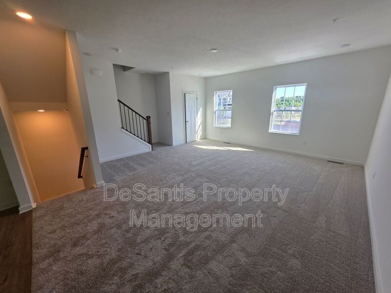 Brand-new townhome with modern finishes, flexible living space, and low-maintenance living. property image