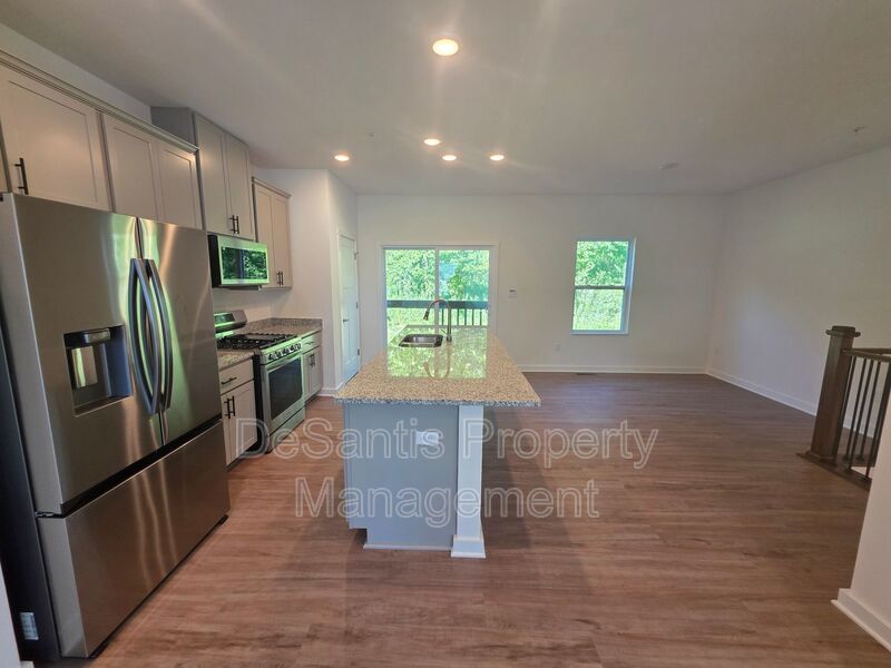 Brand-new townhome with modern finishes, flexible living space, and low-maintenance living. property image