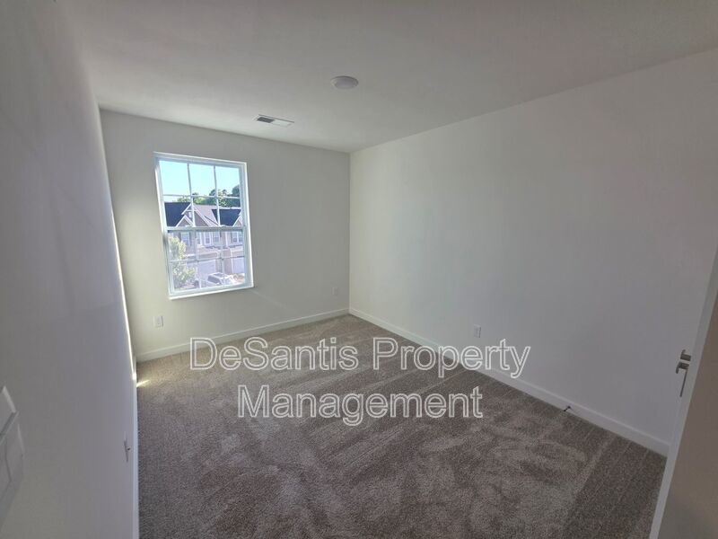 Brand-new townhome with modern finishes, flexible living space, and low-maintenance living. property image